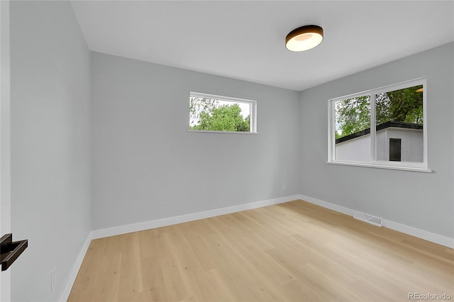 6526 S Elmwood St, Littleton, CO 80120 - unfurnished room with wood finished floors and plenty of natural light