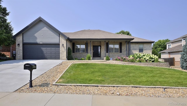 1735 Crestone Dr, Longmont, CO 80504 - ranch-style home featuring driveway, brick siding, an attached garage, and a front lawn