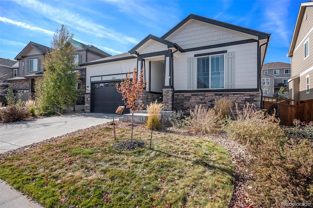 view of front of home with a garage and a front lawn