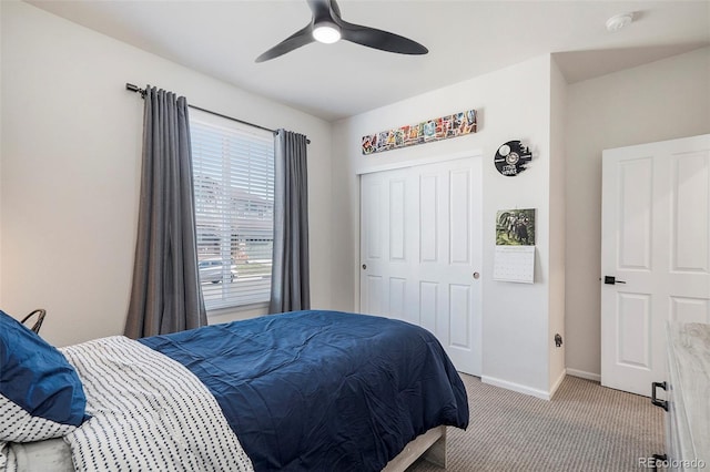 bedroom featuring a closet, ceiling fan, and light colored carpet