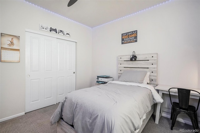 carpeted bedroom with a closet and ceiling fan