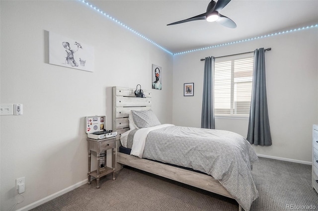 bedroom featuring ceiling fan and carpet