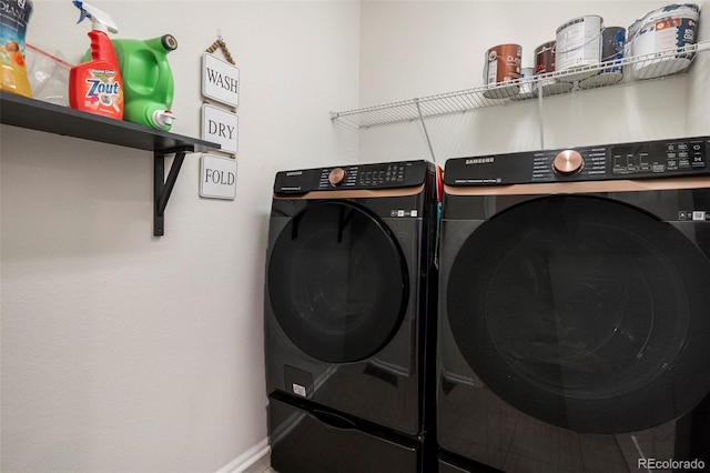 laundry room with washing machine and dryer