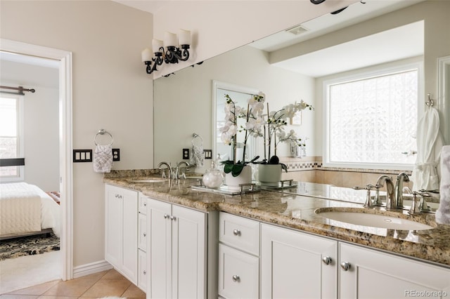 bathroom featuring tile patterned flooring and vanity