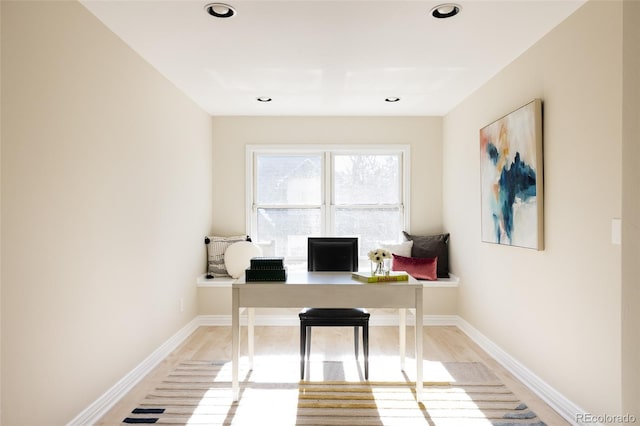 office with light hardwood / wood-style floors