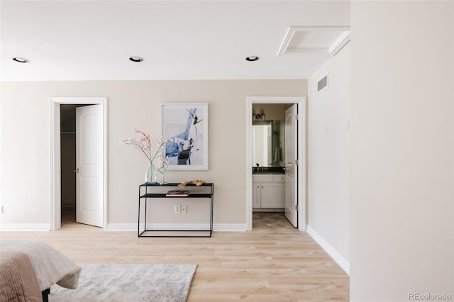 hall with light hardwood / wood-style flooring