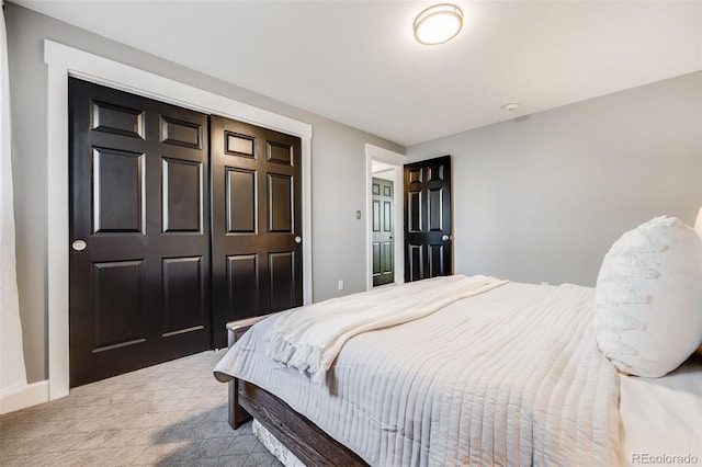 carpeted bedroom with a closet