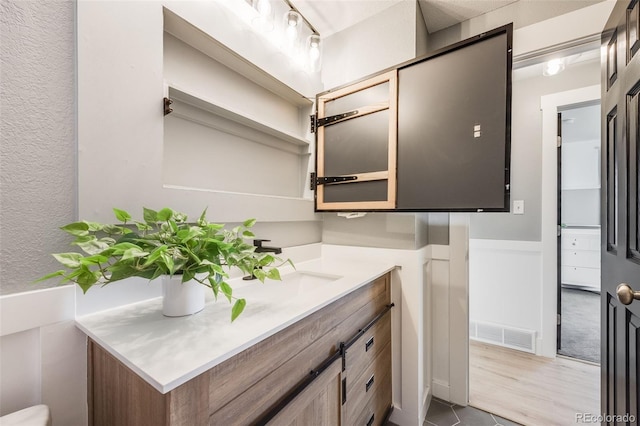 bathroom with visible vents and vanity