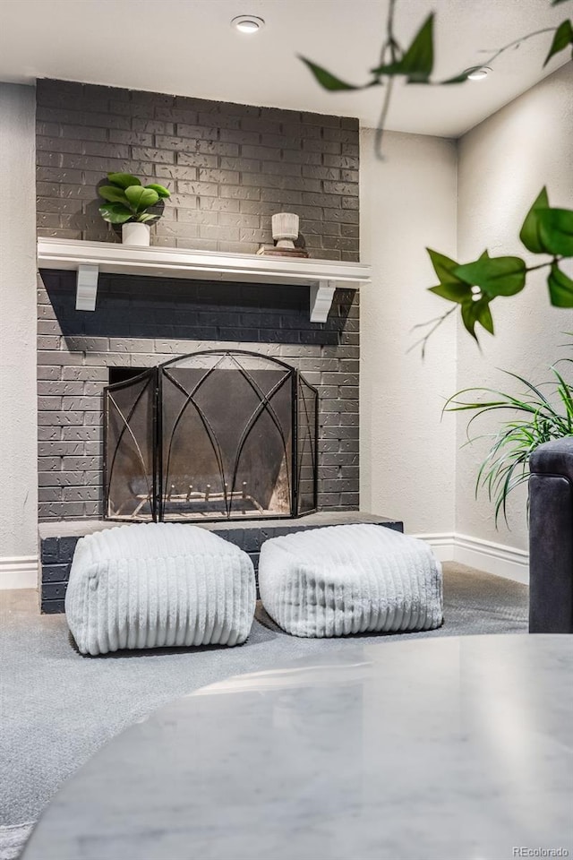 interior details featuring a fireplace and baseboards