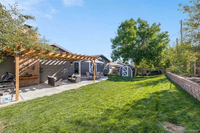 view of yard with an outbuilding, a storage unit, a patio area, a pergola, and a fenced backyard