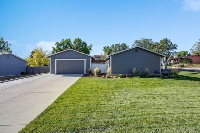 view of front of home with a garage, concrete driveway, a front yard, and fence