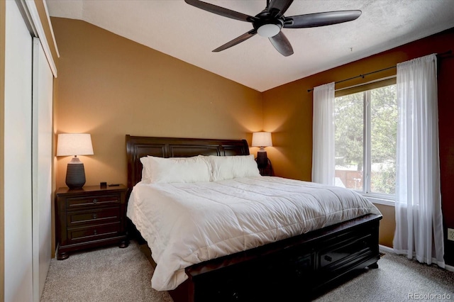 8745 W Ottawa Ave, Littleton, CO 80128 - bedroom featuring carpet flooring, lofted ceiling, and ceiling fan
