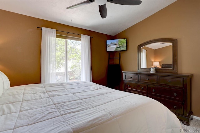 8745 W Ottawa Ave, Littleton, CO 80128 - bedroom with vaulted ceiling, a ceiling fan, and carpet flooring