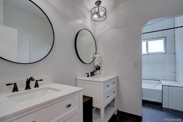 8745 W Ottawa Ave, Littleton, CO 80128 - bathroom featuring two vanities and baseboards