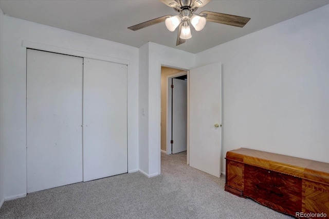 8745 W Ottawa Ave, Littleton, CO 80128 - unfurnished bedroom with carpet, baseboards, ceiling fan, and a closet