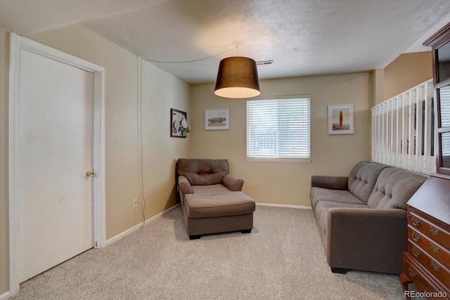 8745 W Ottawa Ave, Littleton, CO 80128 - carpeted living room featuring baseboards