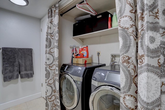 8745 W Ottawa Ave, Littleton, CO 80128 - laundry room featuring washing machine and dryer, baseboards, and tile patterned floors