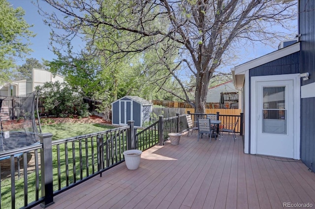 8745 W Ottawa Ave, Littleton, CO 80128 - deck featuring a trampoline and outdoor dining area