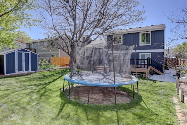 8745 W Ottawa Ave, Littleton, CO 80128 - view of yard with a trampoline and a deck