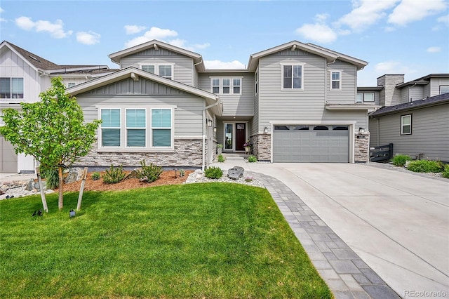 6912 Sunstrand Ct, Castle Pines, CO 80108 - view of front of property with stone siding, driveway, a front lawn, and board and batten siding