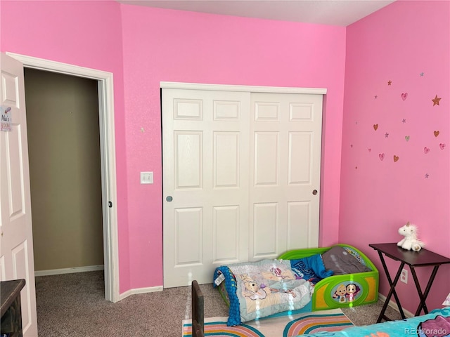 carpeted bedroom featuring a closet