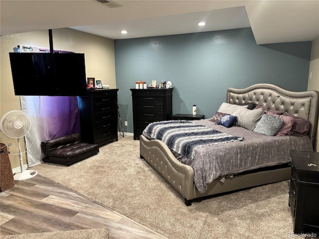 bedroom with hardwood / wood-style flooring