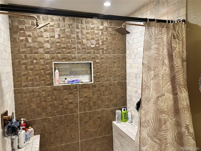 bathroom with a tile shower