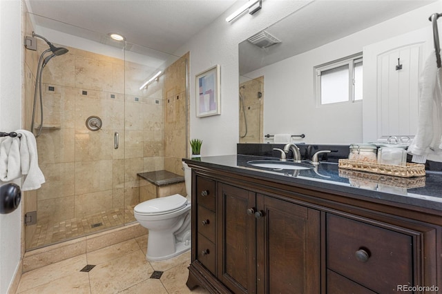 bathroom with vanity, an enclosed shower, tile patterned floors, and toilet