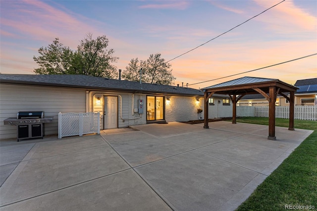 view of front of property featuring a gazebo and a patio area