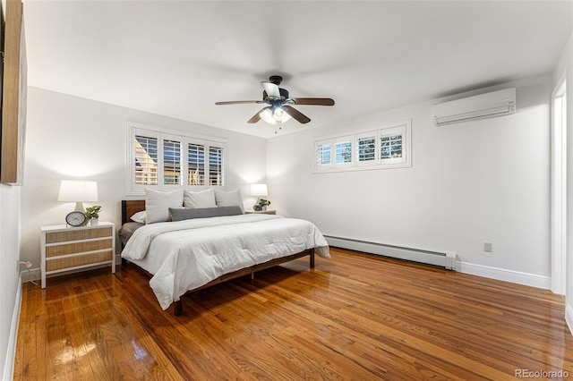 bedroom with ceiling fan, a wall mounted air conditioner, dark hardwood / wood-style flooring, and a baseboard heating unit