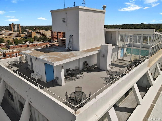 exterior space with outdoor dining area and stucco siding