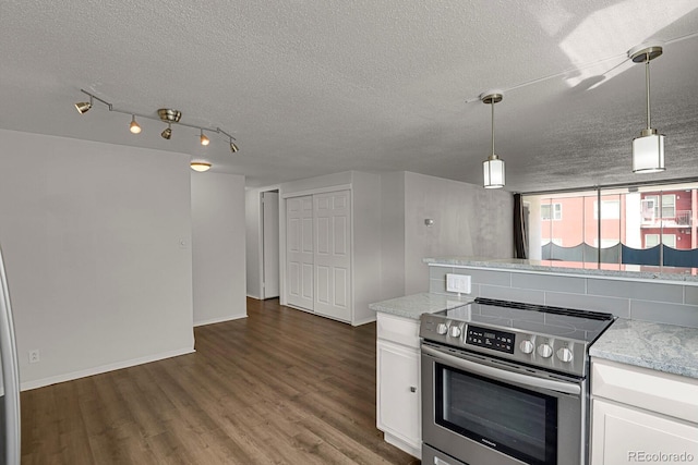 kitchen with light stone countertops, white cabinetry, stainless steel electric stove, and dark wood finished floors