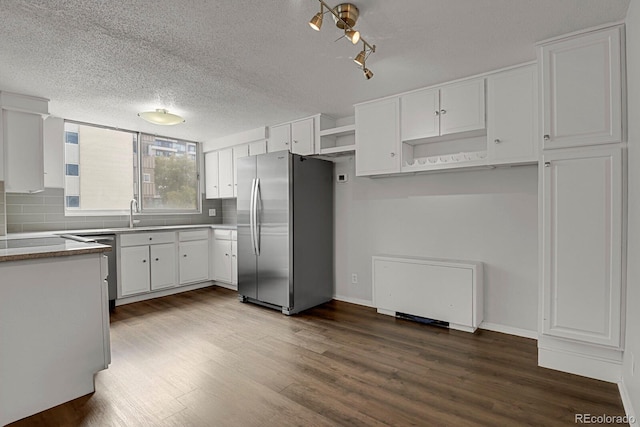 kitchen with stainless steel appliances, tasteful backsplash, dark wood-type flooring, and open shelves