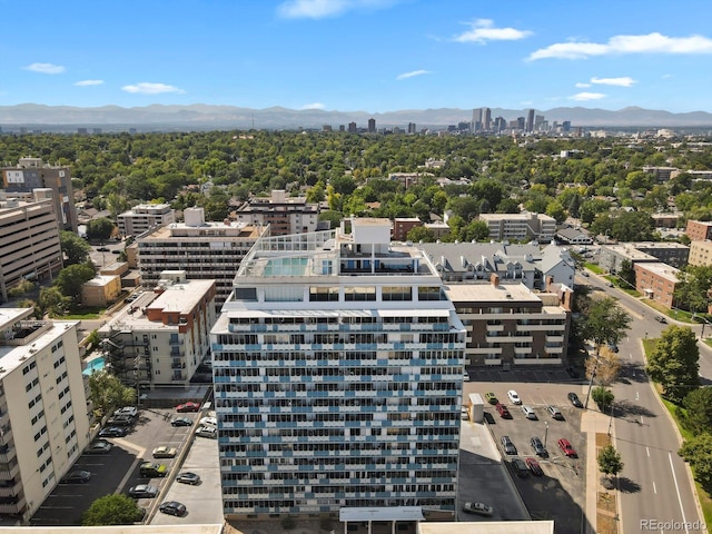 birds eye view of property with a view of city and a mountain view