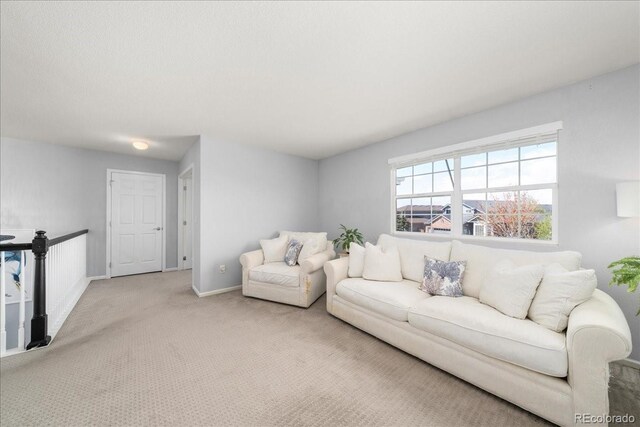 2153 Mountain Iris Dr, Erie, CO 80516 - living room featuring carpet floors and baseboards
