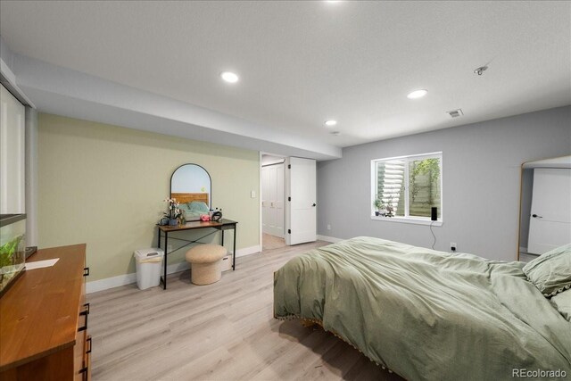 2153 Mountain Iris Dr, Erie, CO 80516 - bedroom featuring light wood finished floors, recessed lighting, and baseboards