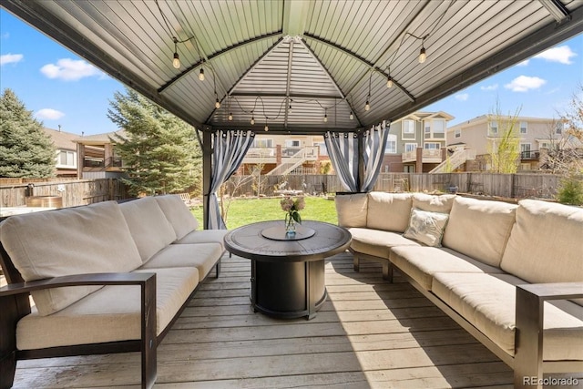 2153 Mountain Iris Dr, Erie, CO 80516 - wooden deck with an outdoor living space, a gazebo, and a residential view