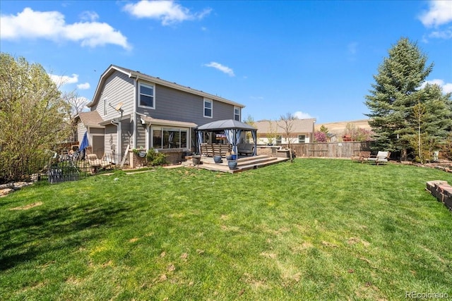 2153 Mountain Iris Dr, Erie, CO 80516 - rear view of house featuring a gazebo