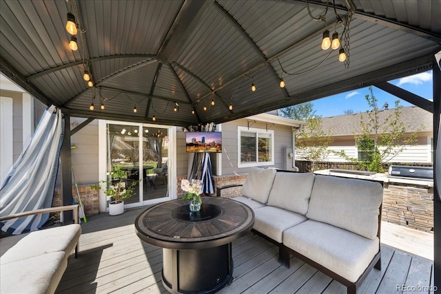 2153 Mountain Iris Dr, Erie, CO 80516 - wooden terrace with a gazebo, an outdoor living space, and an outdoor kitchen