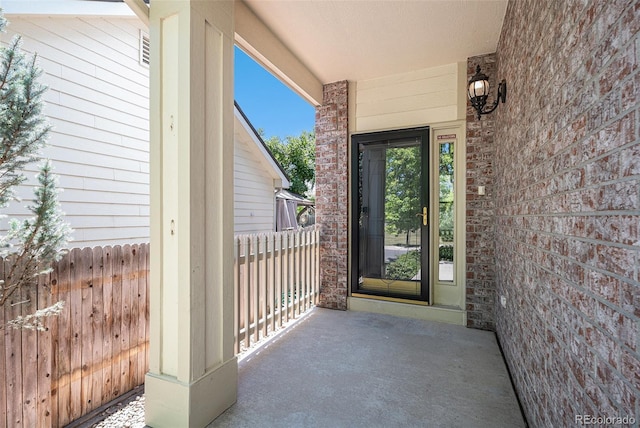 11868 W Progress Ave, Littleton, CO 80127 - entrance to property featuring brick siding and covered porch
