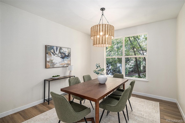 11868 W Progress Ave, Littleton, CO 80127 - dining area featuring wood finished floors and a chandelier