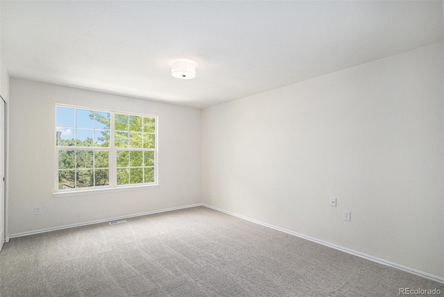 11868 W Progress Ave, Littleton, CO 80127 - spare room featuring carpet floors and baseboards