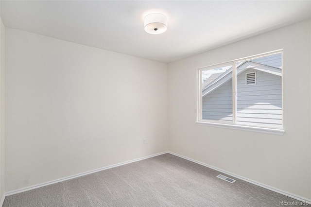 11868 W Progress Ave, Littleton, CO 80127 - carpeted spare room featuring baseboards