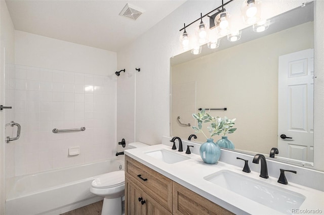 11868 W Progress Ave, Littleton, CO 80127 - full bath featuring double vanity, shower / bathtub combination, and wood finished floors