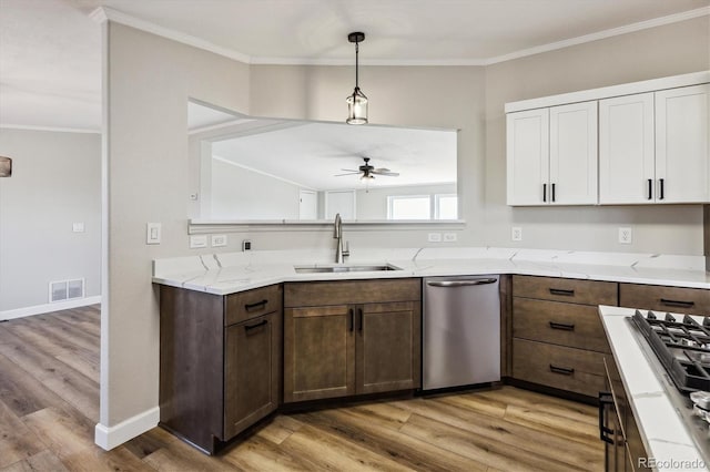 kitchen featuring ceiling fan, sink, dishwasher, white cabinets, and light hardwood / wood-style floors