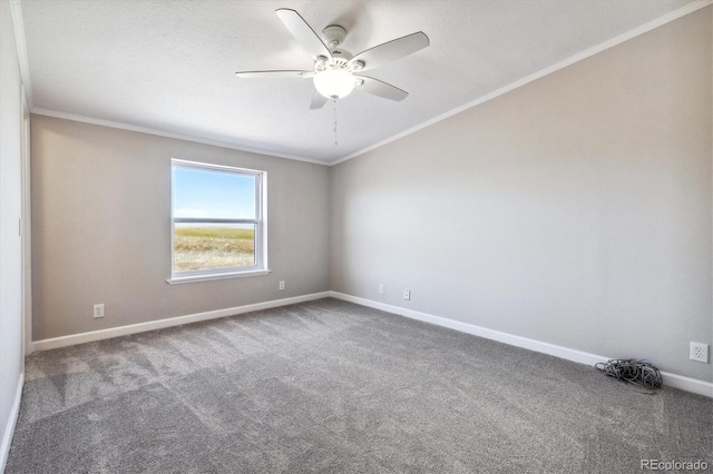 carpeted empty room with ceiling fan and ornamental molding