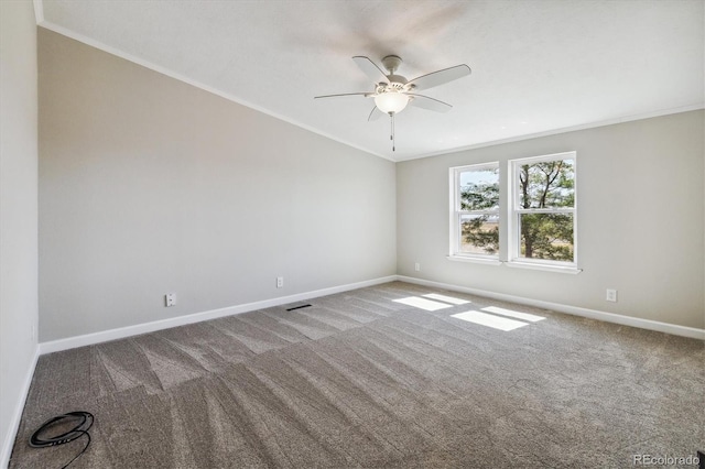 carpeted empty room featuring ceiling fan and ornamental molding