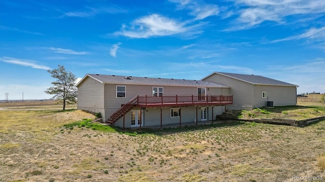 back of house featuring a deck and central AC