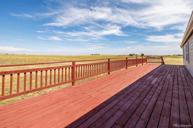 wooden deck with a rural view