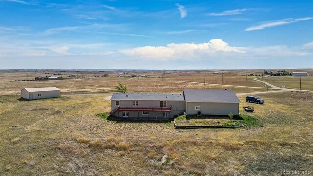 birds eye view of property featuring a rural view